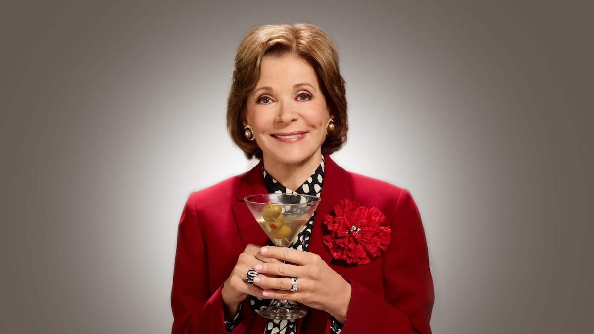 Jessica Walter holding a martini.