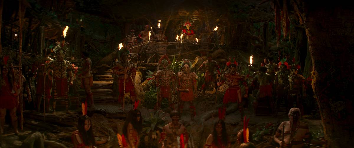 A scene from the movie depicting indigenous peoples of the Amazon in traditional dress. 